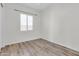 Bright bedroom with wood-look floors and window coverings at 10141 E Stealth Ave, Mesa, AZ 85212