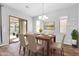 Cozy dining area with patio access and a view of the backyard at 10141 E Stealth Ave, Mesa, AZ 85212