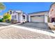 Craftsman style home with a 2-car garage and neutral color palette at 10141 E Stealth Ave, Mesa, AZ 85212