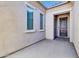 Inviting front entry with a dark wood door and neutral color scheme at 10141 E Stealth Ave, Mesa, AZ 85212
