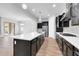 Large island kitchen with stainless steel appliances, island sink, and pendant lighting at 10141 E Stealth Ave, Mesa, AZ 85212