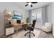 Comfortable home office setup with a sleek desk, swivel chair, and modern decor at 10141 E Stealth Ave, Mesa, AZ 85212