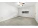 Simple bedroom with carpet, ceiling fan and window at 10314 W Manzanita Dr, Sun City, AZ 85373