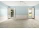 Light and airy bedroom with carpet flooring and ceiling fan at 10314 W Manzanita Dr, Sun City, AZ 85373