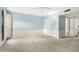 Spacious bedroom with light blue walls and carpet flooring at 10314 W Manzanita Dr, Sun City, AZ 85373