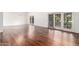 Spacious dining room with hardwood floors and access to patio at 10314 W Manzanita Dr, Sun City, AZ 85373