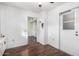 Hallway with wood flooring and doors to other rooms at 10314 W Manzanita Dr, Sun City, AZ 85373
