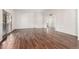 Bright living room featuring hardwood floors and sliding glass doors at 10314 W Manzanita Dr, Sun City, AZ 85373