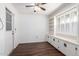 Room with built-in shelving, window shutters and wood floor at 10314 W Manzanita Dr, Sun City, AZ 85373