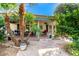 Inviting patio with brick pavers, lush landscaping, and seating area at 10314 W Manzanita Dr, Sun City, AZ 85373