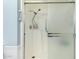 Clean shower stall with glass door and handheld shower head at 10314 W Manzanita Dr, Sun City, AZ 85373