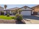 House exterior features a single-story design, white walls, and a brown tile roof at 10873 W Carlota Ln, Peoria, AZ 85373
