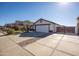 House exterior with a two-car garage and gated driveway at 10873 W Carlota Ln, Peoria, AZ 85373
