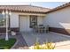 Small patio with seating area next to the house entrance at 10873 W Carlota Ln, Peoria, AZ 85373