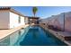 Long rectangular pool, spacious backyard with covered patio at 10873 W Carlota Ln, Peoria, AZ 85373