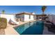 Inviting backyard pool with a slide and patio area at 10873 W Carlota Ln, Peoria, AZ 85373