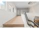 Modern upper hallway with hardwood floors and large chandelier at 10975 E Bahia Dr, Scottsdale, AZ 85255