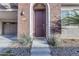 Elegant front door entrance with brick facade and landscaping at 1112 E Newland Dr, Chandler, AZ 85286