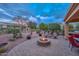 Backyard patio with fire pit and seating at 12750 W Nogales Dr, Sun City West, AZ 85375