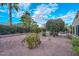 Landscaped backyard with fire pit and desert landscaping at 12750 W Nogales Dr, Sun City West, AZ 85375