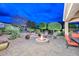 Relaxing backyard patio featuring fire pit and seating area at 12750 W Nogales Dr, Sun City West, AZ 85375