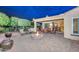 Relaxing patio with fire pit and seating area at 12750 W Nogales Dr, Sun City West, AZ 85375