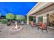 Spacious backyard patio with fire pit and seating at 12750 W Nogales Dr, Sun City West, AZ 85375