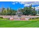 Entrance to Corte Bella community featuring a fountain and lush landscaping at 12750 W Nogales Dr, Sun City West, AZ 85375