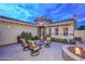 Stone fireplace and seating area in a charming courtyard at 12750 W Nogales Dr, Sun City West, AZ 85375