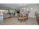 Open concept dining area adjacent to living room and kitchen at 12750 W Nogales Dr, Sun City West, AZ 85375