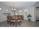 Formal dining room with wooden table and chairs, and natural light at 12750 W Nogales Dr, Sun City West, AZ 85375