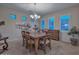 Elegant dining room featuring a wood table and chairs, decorative wall art, and a chandelier at 12750 W Nogales Dr, Sun City West, AZ 85375