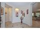 Bright entryway with decorative wall art and tiled flooring at 12750 W Nogales Dr, Sun City West, AZ 85375