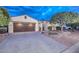Front view of a charming home with a brown garage door and well-manicured landscaping at 12750 W Nogales Dr, Sun City West, AZ 85375