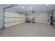Spacious garage with epoxy floor and ample storage at 12750 W Nogales Dr, Sun City West, AZ 85375