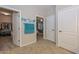Well-lit hallway with access to bedrooms and closets at 12750 W Nogales Dr, Sun City West, AZ 85375