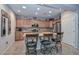 Modern kitchen with island, stainless steel appliances, and wood cabinets at 12750 W Nogales Dr, Sun City West, AZ 85375