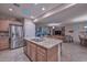 Open kitchen with island and granite countertops at 12750 W Nogales Dr, Sun City West, AZ 85375