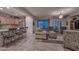 Open kitchen with granite countertops, stainless steel appliances, and a breakfast bar at 12750 W Nogales Dr, Sun City West, AZ 85375