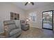 Relaxing living room with two comfy recliners, and view to backyard at 12750 W Nogales Dr, Sun City West, AZ 85375