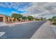 Rainbow over a quiet residential street with charming homes and landscaping at 12750 W Nogales Dr, Sun City West, AZ 85375