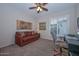 Home office featuring a comfortable sofa and large workspace at 12750 W Nogales Dr, Sun City West, AZ 85375