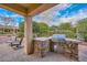 Built-in outdoor kitchen with stainless steel grill at 12750 W Nogales Dr, Sun City West, AZ 85375