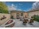 Private patio featuring a fire pit and comfortable seating area at 12750 W Nogales Dr, Sun City West, AZ 85375