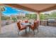Spacious covered patio, dining area, fire pit and grill at 12750 W Nogales Dr, Sun City West, AZ 85375