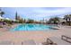 Inviting community pool with lounge chairs and umbrellas at 12750 W Nogales Dr, Sun City West, AZ 85375