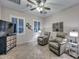 Relaxing sitting room with two comfortable recliners, a TV, and decorative storage cabinet at 12750 W Nogales Dr, Sun City West, AZ 85375