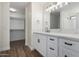 Elegant bathroom with double vanity, quartz countertop, and gold fixtures at 1311 E Kelsi Ave, San Tan Valley, AZ 85140