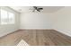 Bright bedroom with wood-look flooring and ceiling fan at 1311 E Kelsi Ave, San Tan Valley, AZ 85140