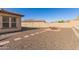 Private backyard with gravel landscaping, patio furniture, and a small grassy area at 16221 S 35Th Dr, Phoenix, AZ 85045